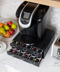72 Pod Coffee Drawer Organizer With Two Tier Storage For Single Serve Pods Countertop Base to Support Most Coffee Machines and Keep Pods Neatly Sorted in Twelve Rows Black with open drawers and various pods