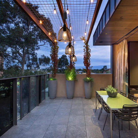 Battery Powered Hanging Pendant Light Outdoor Waterproof Chandelier With 6 Hour Timer illuminating a modern patio