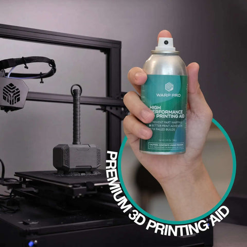 Hand holding a spray can labeled "High Performance Printing Aid" near a 3D printer, showing Pro Grade 3D Printer Bed Adhesive Spray For Warp Free Prints Easy Spray On Build Plate Solution That Is Water Washable No More Glue Sticks Works With All Filaments And Build Surfaces.