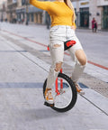 Person riding a 16 Inch Adjustable Unicycle For Outdoor Fitness And Fun, Rugged Ergonomic Design With Durable Plastic And Metal Construction