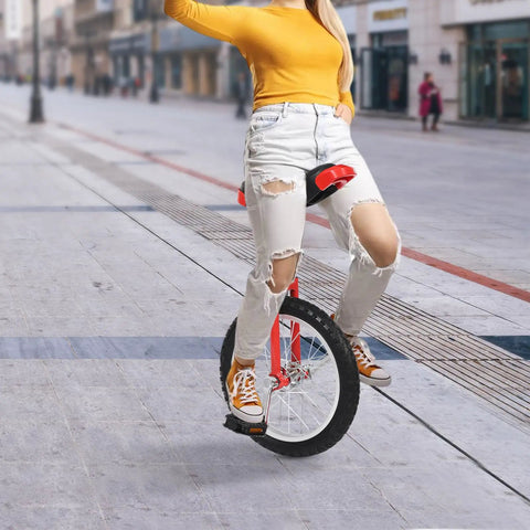 Person riding a 16 Inch Adjustable Unicycle For Outdoor Fitness And Fun, Rugged Ergonomic Design With Durable Plastic And Metal Construction