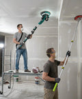 Two men using Electric Drywall Sander Kit With Integrated Vacuum Dust Collector And Telescoping Pole Sander Attachment for wall prep.