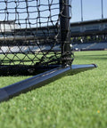 Close-up of base showing beefy steel frame of Baseball L Net Protective Screen for Batting, 7x7 ft, with quick connect joints on grass.