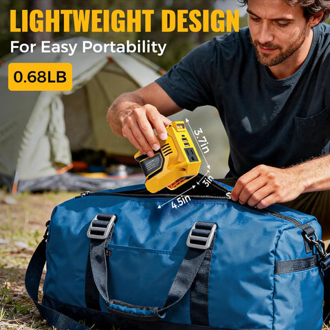 Man using DeWALT 20V Battery Compatible 200W Power Inverter for Camping and Outdoors on blue bag, camping tent visible