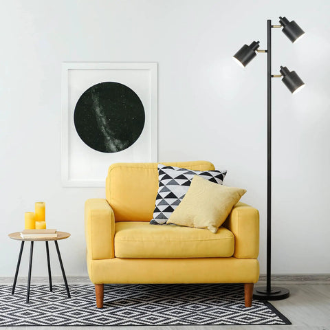 66 Inch Three Head Floor Lamp With Adjustable Heads In Satin Black Finish And Brass Accents beside yellow armchair