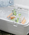 Beast Mode Heavy Duty 120 Qt Polar Cooler With UV Shield Lid filled with ice and canned drinks, open lid view