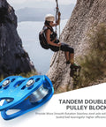 Climber using Beefy Built Tough Zip Line Pulley Tandem Speed Double Pulley 30KN 6700LBS Breaking Strength For 1/4 5/16 3/8 1/2 Inch Cable Backyard Zipline Hauling Rigging And Commercial Use on a cliff.