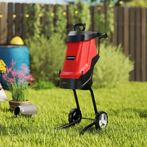 Powerful 15 Amp Corded Wood Chipper Shredder With 15 To 1 Reduction on lawn with collection bag and wheel kit
