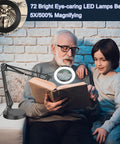 Elderly man using 2-In-1 Magnifying Lamp With Light And Clamp Stand, 5X Magnifier to read book with grandchild
