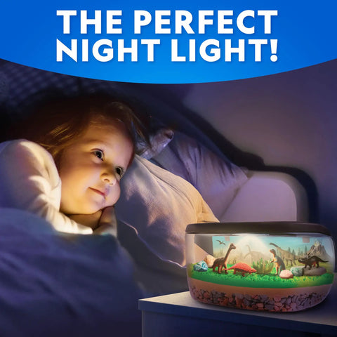 Light Up Dinosaur Terrarium Science Kit For Kids With Never Dry Sand Dino Figures A Backdrop And Gems Create A Colorful Prehistoric World You Can See Through A Wide Mouth Panorama View.