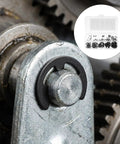 Close-up of 120 Piece Black E Clip Retaining Ring Kit With 10 Size Open Design External Circlip Set on machinery