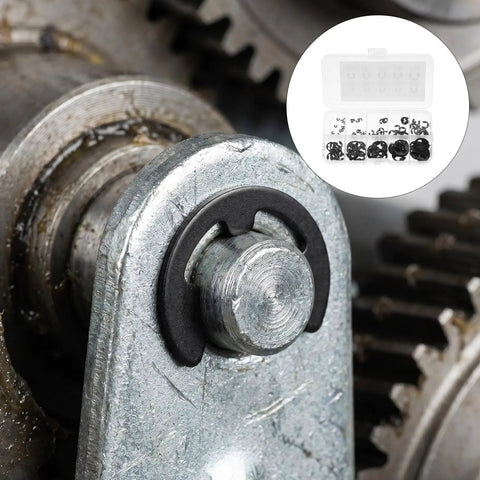 Close-up of 120 Piece Black External Retaining Ring Kit M1.5 To M10 With Open Design Beryllium Bronze Snap Ring on metal shaft in gear