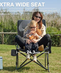 Oversized Folding Camping Chair For Outdoors with side pockets, high back, and extra wide seat supporting family use, in garden.