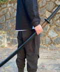 Person holding 41 Inch Polypropylene Katana Sword For Training With Black Scabbard High Toughness Practice Blade