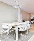 Modern Crystal Flush Mount Ceiling Light Fixture Dope With 12 Inch Round Crystal Shade over dining table in contemporary room