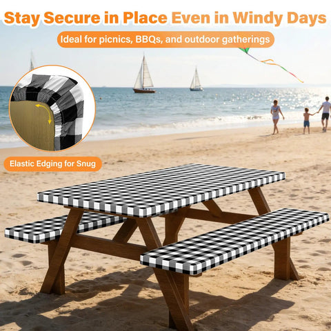 Six Foot Picnic Table Cover With Bench Covers Set All Weather Dual Layer Waterproof Tablecloth With Windproof Elastic Edging Includes Drawstring Bag Washable RV Camping Accessories 72x30 Inch Table Cover And 72x12 Inch Bench Covers Black Checkered in use at beach setting with kite flying