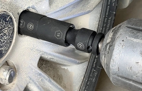 Heavy Duty Double Ended Six Point Impact Flip Socket Set in use on a tire with a power tool