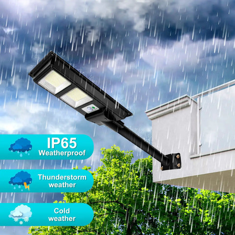 2 Pack 200W Solar Street Light LED 6000LM Outdoor Waterproof Dusk to Dawn Parking Lot Light Solar Powered No Wiring Needed Easy Wall or Pole Mount IP65 Commercial Grade shown mounted during rain