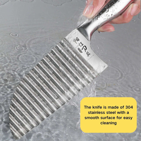 Crinkle cutter knife, stainless steel with a wavy blade, close-up view held under running water.