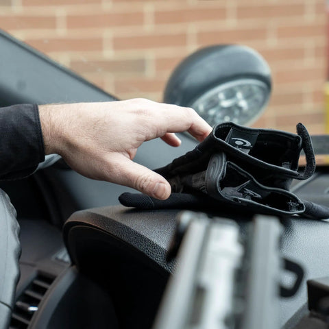 Person using StreetGuard Kevlar Cut Resistant Work Glove With Stretch Back For Breathable Comfort on car dashboard