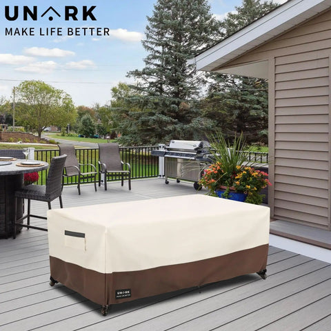 Outdoor Patio Coffee Table Cover 600D Waterproof Rugged Heavy Duty Table Cover For Beige And Brown 48 X 28 X 16 Inches Weatherproof Shield For Patio Furniture shown on deck with grill and chairs.