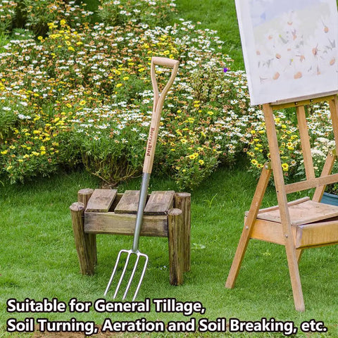 Beefy 4 Tine Garden Digging Fork With Long Ash Wood Handle And D Grip displayed on a wooden stand in a garden setting.