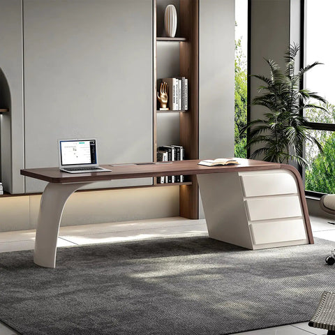 Slick Oversized L Shaped Home Office Desk With Solid Wood Base And Deep Storage Drawers Large Rock Board Top from a side angle.