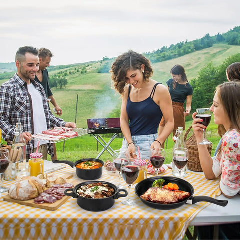 Travel Ready 13 Piece Nonstick Cookware Set with lightweight cast iron pots and pans in outdoor picnic setting