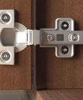 Close-up of metal hinge on wooden cabinet door using Power-Fast II 3.5 X 30 Mm Wood Screws Box Pack Of 90 Zinc Plated For Solid Wood And Wood To Wood Joints Pro Grade Hardware With Sharp Point Prevents Slippage And Splintering Great For DIY Carpentry And Quick Fixes