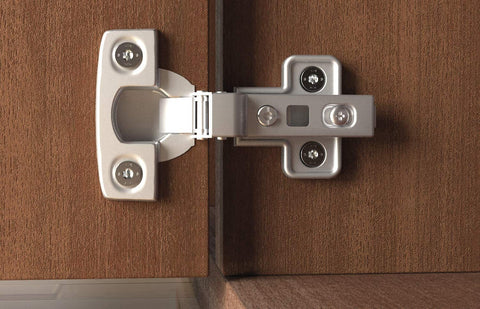 Close-up of metal hinge on wooden cabinet door using Power-Fast II 3.5 X 30 Mm Wood Screws Box Pack Of 90 Zinc Plated For Solid Wood And Wood To Wood Joints Pro Grade Hardware With Sharp Point Prevents Slippage And Splintering Great For DIY Carpentry And Quick Fixes