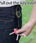 Person using Beefy Heavy Duty Retractable Keychain With Multitool Carabiner Badge Holder And Id Clip Upgraded 58 Cm Stainless Steel Cord for keys