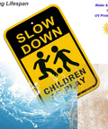 Slow Down Sign for Kids at Play 2 Pack Aluminum Safety Caution Signs for Street Yard and Neighborhoods 18 by 12 Inches Black and Yellow Reflective UV Coated Outdoor Signs front view