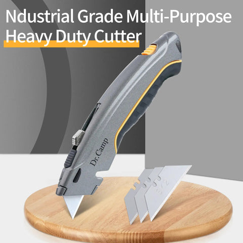 Retractable Utility Knife Heavy Duty Zinc Alloy Box Cutter With 3 SK2 Blades Safety Box Opener For Cardboard Carpet Leather And Packages Built Tough For Everyday Use And The Daily Hustle., gray retractable utility knife with 3 SK2 blades on wooden base