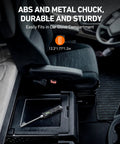 AstroAI digital tire pressure gauge, black with LCD, resting in car center console cubby
