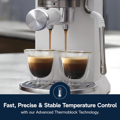 Compact Espresso And Cold Brew Coffee Maker Featuring Built In Milk Frother Wand For Next Level Iced Lattes Smooth Hot Drinks And Straight Up Barista Quality Blends Daily brewing espresso into double glass cups.