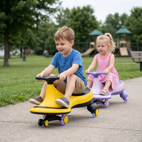 Two toddlers riding The Totally Hassle Free Wiggle Car For Toddlers With Super Slick Flashing LED Wheels on a park pathway.