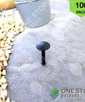 Heavy Duty 4 Inch Landscape Spikes For Weed Fabric Tarps And Erosion Control Durable Plastic Stakes Pack Of 100 shown in use