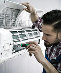 Man using Magnetic Screwdriver Set With Slotted Phillips And Star Bits, Pro Grade S2 Steel Shafts, ergonomic handle, on AC unit.
