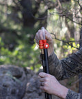 Pocket Ready Muzzleloader Quick Loader Kit with BH209 Tubes in use outdoors, compact low profile orange accessory