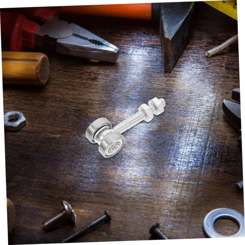 Built Like A Tank Stainless Steel Sliding Door Hanger With Double Bearing Track Rollers displayed on a wooden surface with tools.