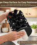 Person cleaning Coffee Pod Carousel Organizer For Countertop Holds 40 K Cups In A Compact 8 By 8 Inch Base With Smooth 360 Degree Rotating Holder A Space Saving Must Have For Busy Kitchens And Mornings