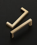 Two Champagne Bronze Slim Cabinet Handles displayed on a dark background, part of a 10 Pack Solid Square Bar Drawer Pulls for Kitchen Cabinets.