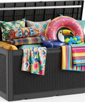 Heavy Duty 160 Gallon Deck Box Crafted From Weatherproof Resin With Secure Locking Lid, filled with colorful cushions and pool floats.