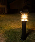 Solar Pathway Light With Stainless Steel Bollard, Waterproof Outdoor Landscape LED Lamp illuminating a garden pathway at night