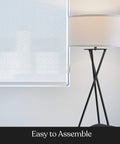LED Floor Lamp Tall Tripod With Drum Shade In Black Finish And Gold Accents, shown against a white wall.