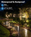 Outdoor walkway lit by All In One Outdoor Landscape Lighting Kit With 60W Low Voltage Transformer 100 Ft Wire 6 Anti Glare LED Pathway Lights 2 Spotlights And Quick Connectors For Walkway Garden And Yard in rain at night.