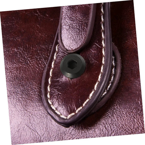 Close-up of black stainless steel binding screw installed in leather using Top Shelf Five Piece Pack Of Black Stainless Steel Binding Screws And Nuts For Scrapbooks Photo Albums And Bookbinding With Countersunk Flat Head For No Sweat Setup.