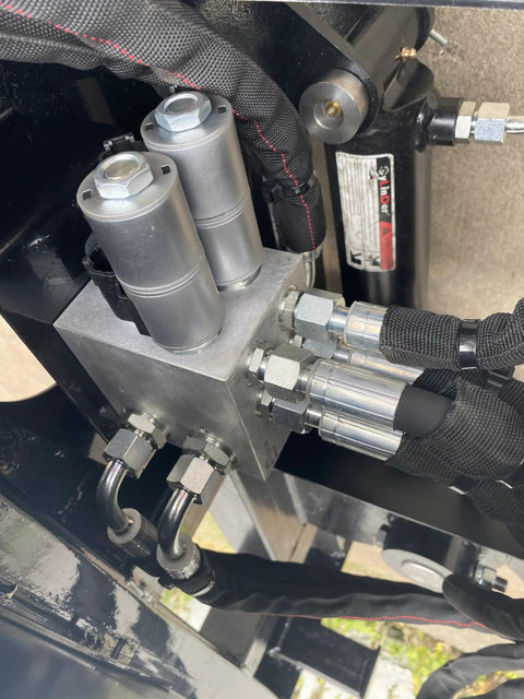 Close-up of hose connectors on Beefy Skid Steer Tree Pruner Attachment With 42 Inch Brush Cutter, heavy-duty use