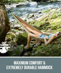 Person relaxing in a Two Person Tree Double Portable Outdoor Travel Hammock Heavy Duty For Campsites And Backyard Easy To Set Up