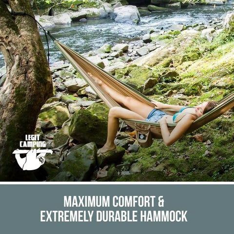 Person relaxing in a Two Person Tree Double Portable Outdoor Travel Hammock Heavy Duty For Campsites And Backyard Easy To Set Up
